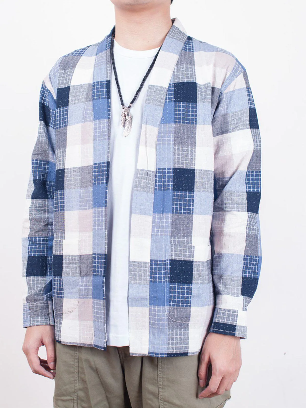 Qutn Throw On Blue Stitched Square
