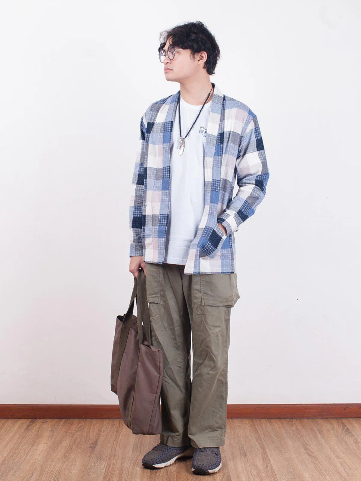 Qutn Throw On Blue Stitched Square