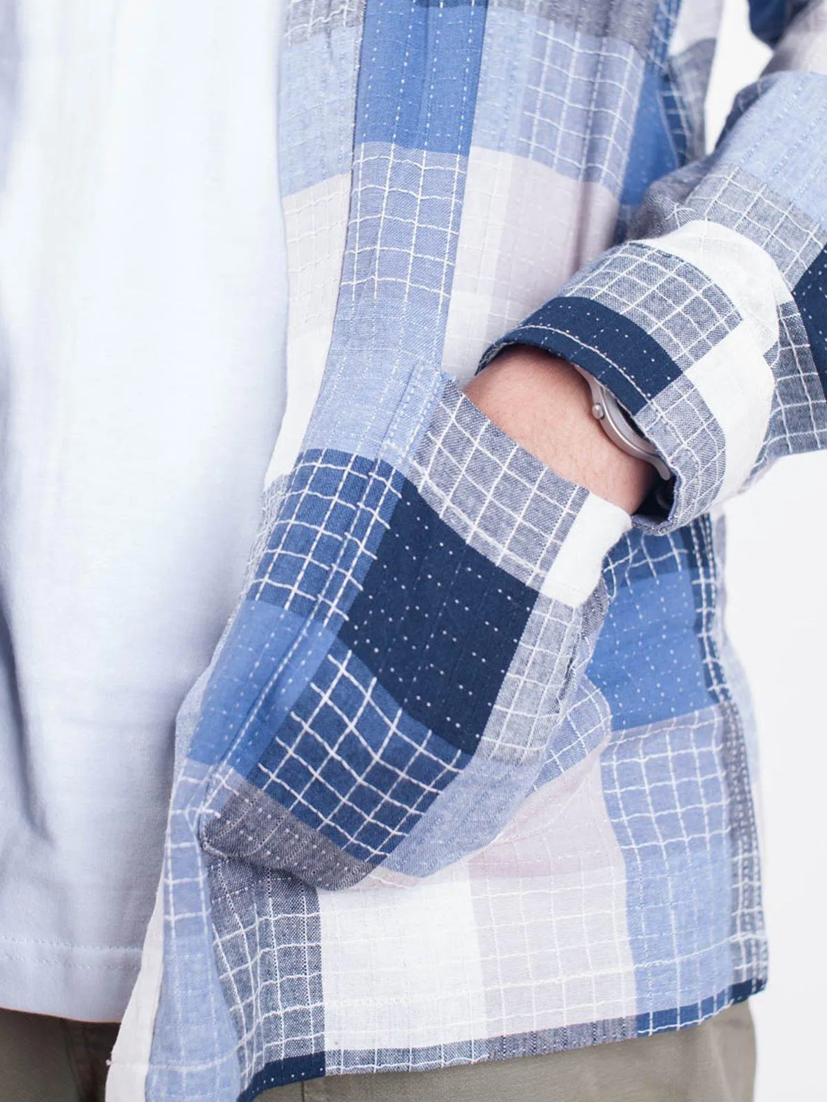 Qutn Throw On Blue Stitched Square