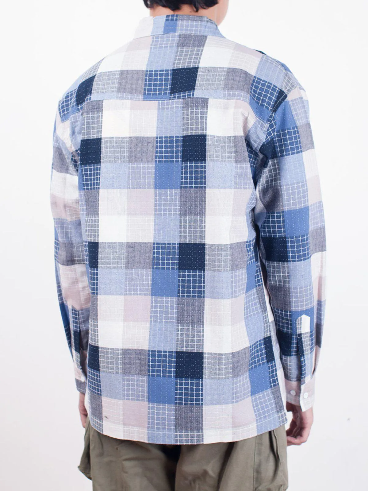Qutn Throw On Blue Stitched Square